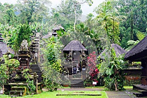 View on Hindu temple in green jungle with traditional puras photo