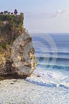 Pura Luhur Uluwatu temple. Amazing landscape - cliff with blue sky and sea Bali, Indonesia