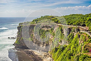 Pura Luhur Uluwatu temple, Bali, Indonesia. Amazing landscape - cliff with blue sky and sea