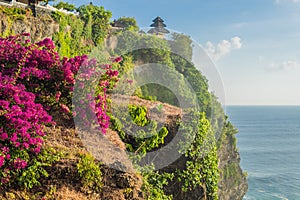 Pura Luhur Uluwatu temple, Bali, Indonesia. Amazing landscape - cliff with blue sky and sea