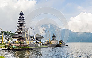 Pura Ulun Danu Bratan, Bali. Hindu temple surrounded by flowers on Bratan lake, Bali. Major Shivaite water temple in