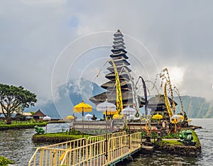Pura Ulun Danu Bratan, Bali. Hindu temple surrounded by flowers on Bratan lake, Bali. Major Shivaite water temple in