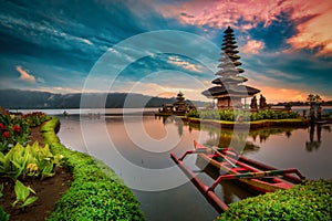 Pura Ulun Danu Bratan, Hindu temple with boat on Bratan lake landscape at sunrise in Bali, Indonesia