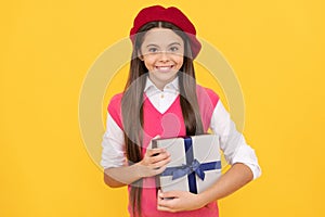purchase a gift. good offer. happy french teen girl hold present box. childhood happiness.