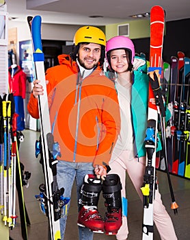 purchasers posing in full skiing gear