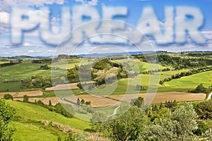 Pure air concept against a green natural wild Tuscany rural landscape Italy