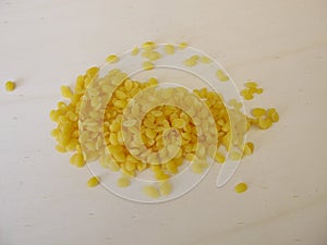 Pure beeswax pastilles for natural cosmetics, candles or beeswraps