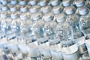 Pure bottled water in small handy bottles for sale on store shelfs
