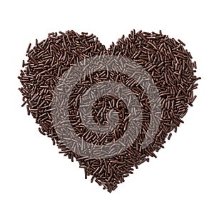 Pure chocolate sprinkles in heart shape on white background photo