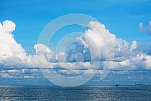 Pure clear blue sky huge white gray cloud and sunlight shiny on tropical on the sea and fishing boat