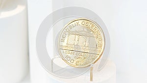 Pure gold coin, Republic of Austria, engraved inscription 1 Unze Gold 999.9 on a small stand, 100 euro worth, high purity and