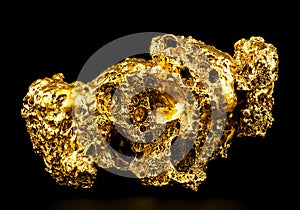 Pure gold from the mine on black background. Gold ore as finance and business concept