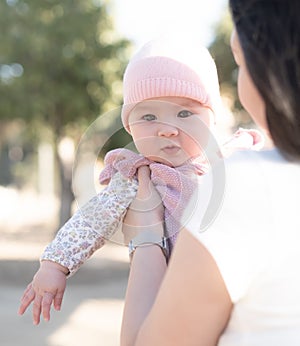 pure joy as a young Asian Chinese mother lovingly plays with her little baby girl, creating a lasting affection happiness bond -