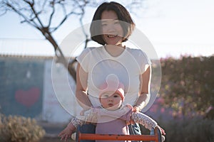 pure joy as a young Asian Chinese mother lovingly plays with her little baby girl, creating a lasting affection happiness bond -