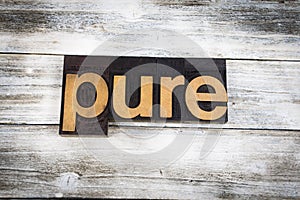 Pure Letterpress Word on Wooden Background