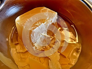 Pure natural beeswax melting. Golden real beeswax melt for craftmanship.
