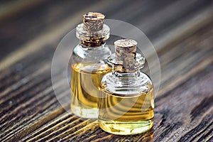 Pure organic aroma essential oil in glass bottle isolated on wooden background beauty treatment. Fragrant oil spa concept wellness