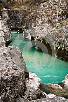 Pure river soca flowing in canyon gorge, julian alps, slovenia