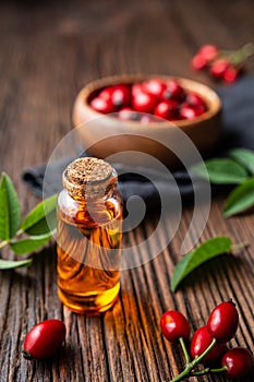 Pure rosehip seed oil in a glass bottle, remedy for skin and hair