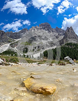 pure spring water stream flowing from mountains glacier