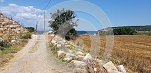 Pure stone pathway in the ancient city of Parion, Canakkale, TÃ¼rkiye photo