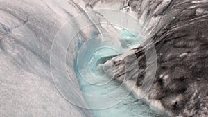 Pure transparent blue water in snowy mountains and glacier in Antarctica.