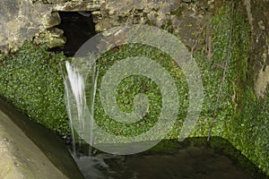 Rustic fountain of a mountain village photo