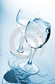 Pure water splashing into glasses