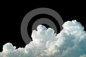 Pure white cumulus clouds on black background. Cloudscape background. White fluffy clouds on dark background. Soft cotton feel of