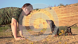 Purebred dog and his owner caucasian man doing summer recreation pursuit outdoors