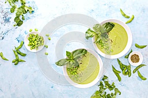 Pureed edamame soup with fresh herbs seasoning  top down view