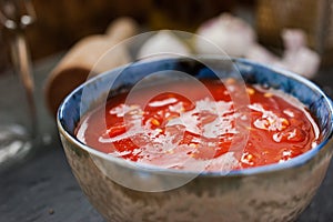 Pureed tomatoes in a ceramic dish on a table