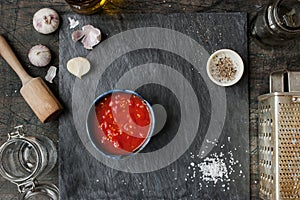 Pureed tomatoes in a ceramic dish on a table