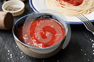 Pureed tomatoes in a ceramic dish on a table