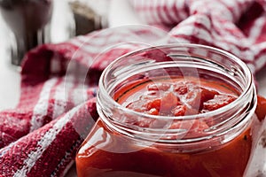 Pureed tomatoes in a glass jar