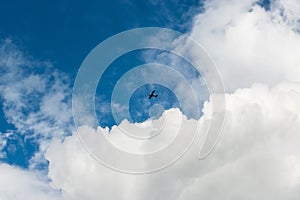 Purely white fluffy white cloud like cotton candy against the clean blue sky photo