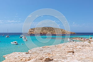 The purest emerald water off the coast of  Cala Comte, beach Cala Escondida. Ibiza, Balearic Islands. Spain photo