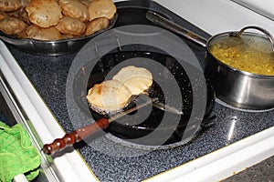 Puri indian food frying in kitchen