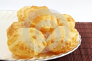 Puri or Poori traditional indian homemade deep fried bread or chapati