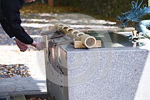 The purification fountain `Chozuya` in the Japanese shrine.