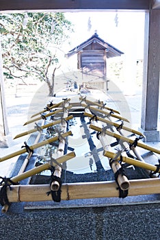 The purification fountain `Chozuya` in the Japanese shrine.