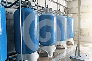 Purified drinking water factory or plant, large iron tanks and water purification filters and automation filtration