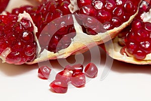 Purified pomegranate fruit on a white background