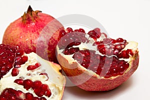 Purified pomegranate fruit on a white background
