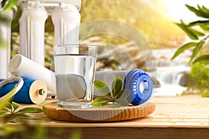 Purified water on wooden table by osmosis with nature background