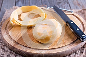 Purified yellow turnips on a wooden table