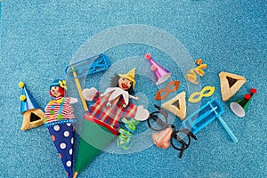 Purim celebration concept. Jewish carnival background. hamantaschen or hamans ears cookies, carnival mask and noisemaker