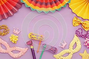 Purim celebration concept & x28;jewish carnival holiday& x29; over pink wooden background. Top view.