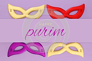 Purim celebration concept & x28;jewish carnival holiday& x29; over pink wooden background. Top view.