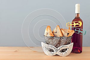 Purim celebration concept & x28;jewish carnival holiday& x29; over white wooden table.